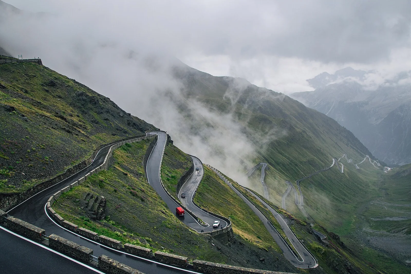 The hairpins below the summit in the fog